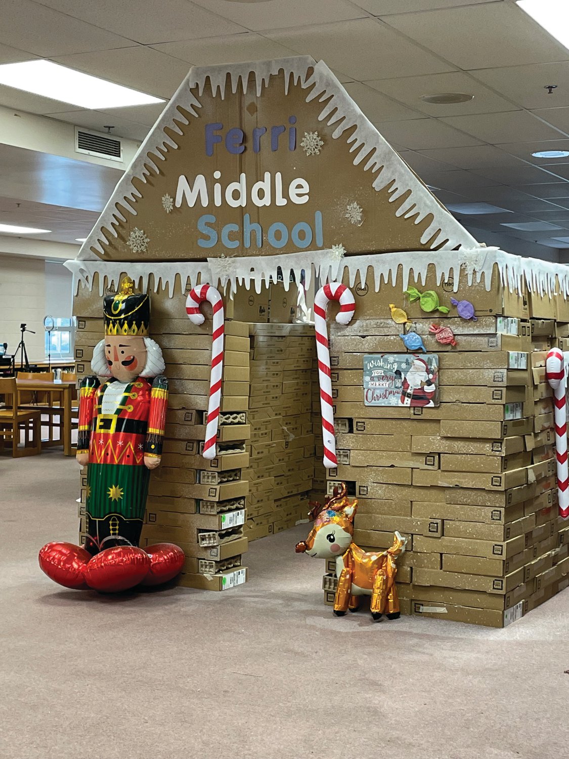 GIANT GINGERBREAD: Nicholas A. Ferri Middle School Librarian Ashley Wheaton and her students built a giant faux gingerbread house out of empty computer boxes salvaged from the school’s new laptops.